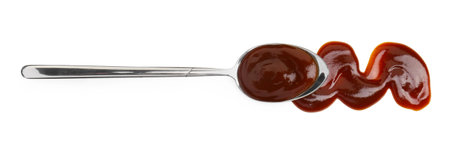 Tasty barbecue sauce and spoon isolated on white, top viewの写真素材
