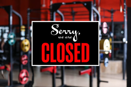 Sorry we are closed sign against blurred backgroundの写真素材