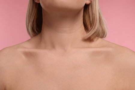 Woman with healthy skin on pink background, closeupの写真素材
