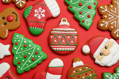 Different tasty Christmas cookies on red background, flat layの写真素材