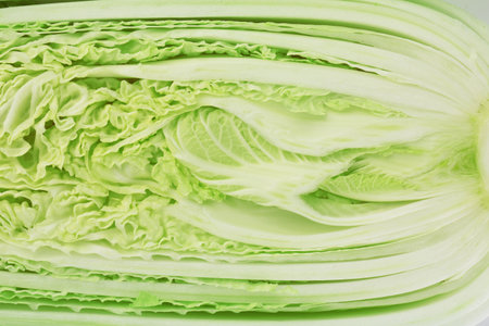 Half of fresh Chinese cabbage as background, top viewの写真素材