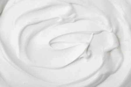Delicious natural yogurt as background, top viewの写真素材