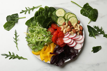 Balanced diet and vegetarian foods. Plate with different delicious products on white table, flat layの写真素材