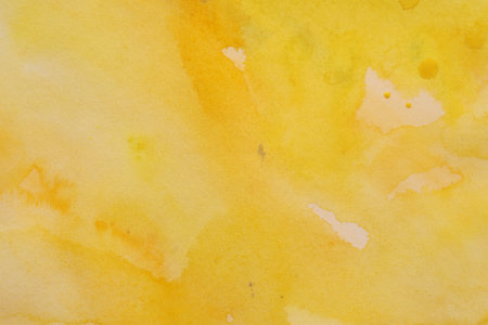 Abstract yellow watercolor painting as background, top viewの写真素材