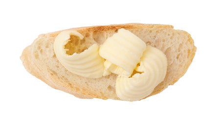 Tasty butter curl and slice of bread isolated on white, top viewの写真素材