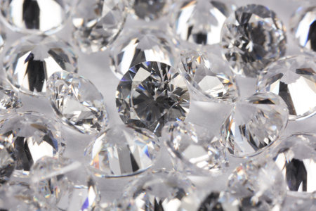 Many beautiful shiny diamonds on light background, closeupの写真素材