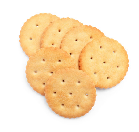 Tasty crispy round crackers isolated on white, top viewの写真素材