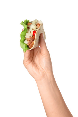 Woman holding delicious taco with meat and vegetables on white background, closeupの写真素材