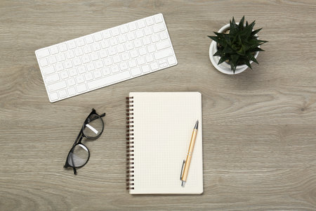 Flat lay composition with notebook on wooden tableの写真素材