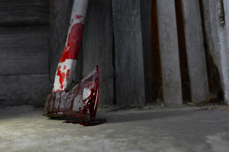 Ax with blood on floor indoors, closeup. Space for textの写真素材