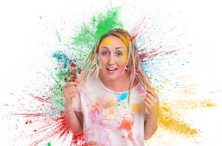 Holi festival celebration. Happy woman covered with colorful powder dyes on white background