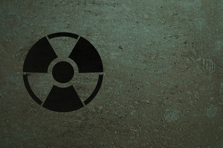 Radioactive sign on stone wall, space for text. Hazard symbolの写真素材