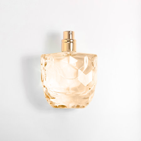 Luxury perfume in bottle on white background, top view