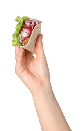 Woman holding delicious taco with meat and vegetables on white background, closeupの写真素材