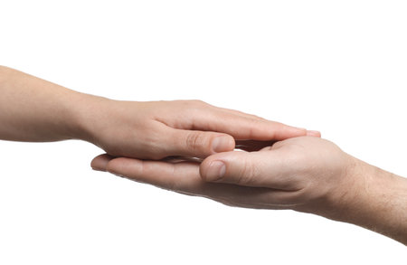 Man and woman holding hands together on white background, closeupの写真素材