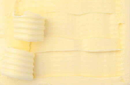 Tasty butter and curls as background, top viewの写真素材