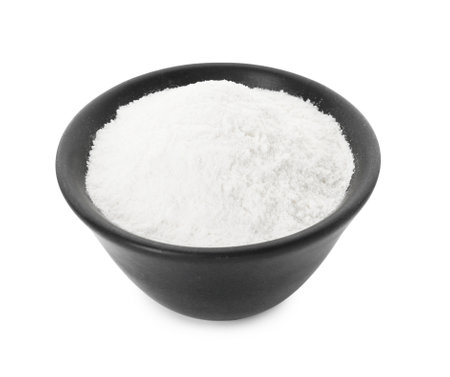 Baking powder in bowl isolated on whiteの写真素材