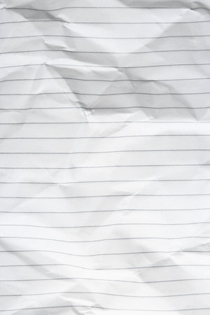Crumpled lined notebook sheet as background, top viewの写真素材