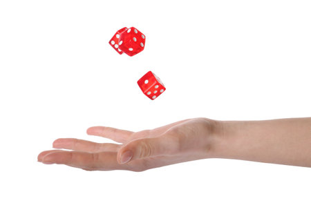 Woman throwing game dices on white background, closeupの写真素材