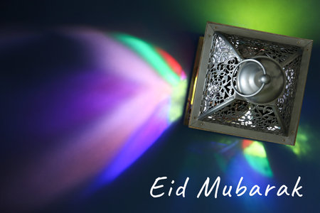 Eid Mubarak greeting card. Arabic lantern on color background, top viewの写真素材