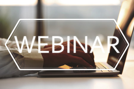 Online webinar. Man using laptop at white table, closeup