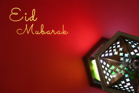 Eid Mubarak greeting card. Arabic lantern on red background, top viewの写真素材