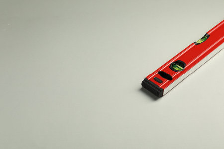 Building level on beige background. Space for textの写真素材