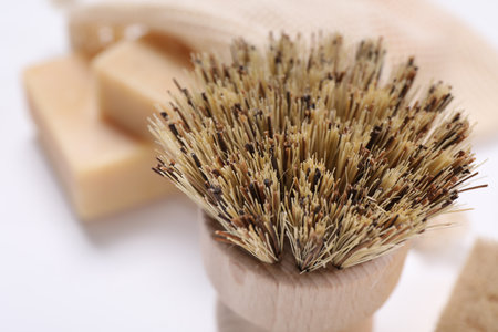 Cleaning brush on white background, closeup view