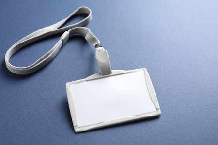 Blank badge with string on blue background