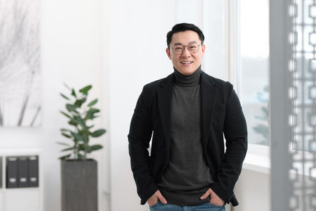 Portrait of smiling businessman in office. Space for textの写真素材