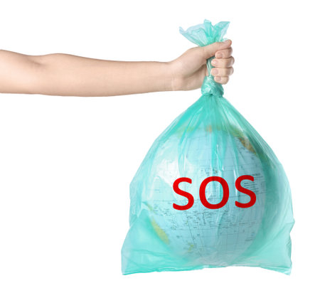 Woman holding globe with word SOS in plastic bag on white background, closeup. Environmental protection conceptの写真素材