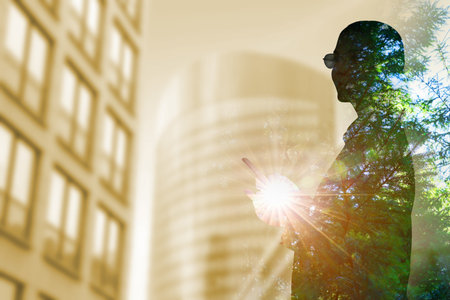 Double exposure of businesswoman and green fir tree in city