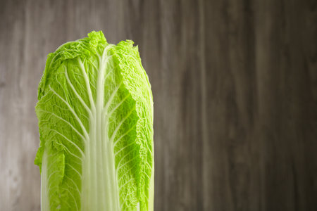 Fresh ripe Chinese cabbage against blurred background, closeup. Space for textの写真素材