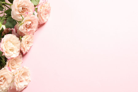 Happy Mother's Day. Beautiful roses on pink background, flat lay. Space for textの写真素材