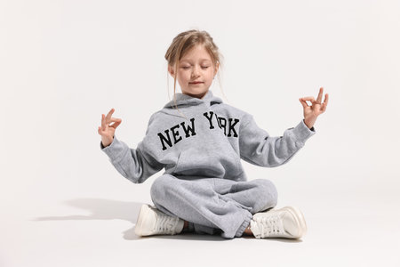 Fashion concept. Stylish girl posing on white backgroundの写真素材