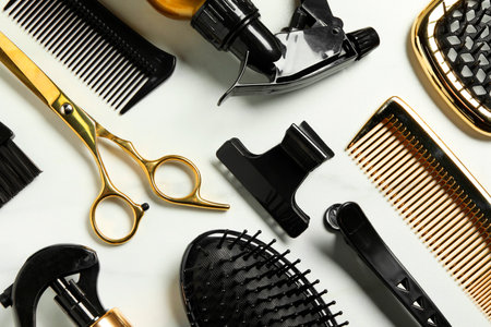 Hairdressing tools on white table, flat layの写真素材