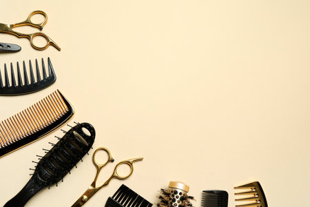 Hairdressing tools on beige background, flat lay. Space for textの写真素材
