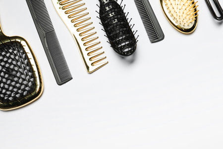 Hairdressing tools on white background, flat lay. Space for textの写真素材