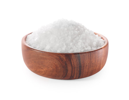 Natural salt in wooden bowl isolated on whiteの写真素材