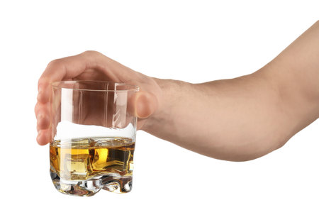 Man holding glass of whiskey with ice cubes on white background, closeupの写真素材