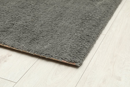 Soft gray carpet on white laminated floor indoors