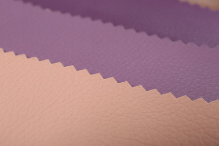 Different colorful types of leather as background, closeup view