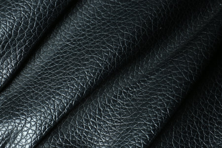 Black natural leather as background, above view