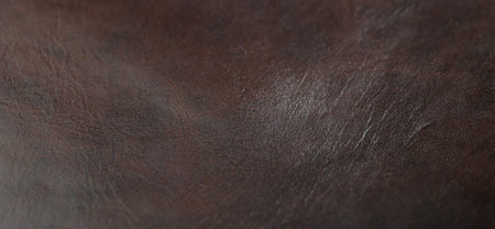Texture of brown leather as background, closeup