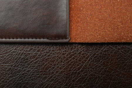Texture of different leather as background, top view
