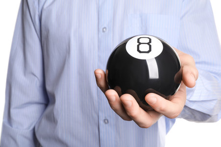 Man holding magic eight ball on white background, closeupの写真素材