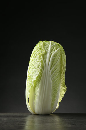 Fresh ripe Chinese cabbage on gray table