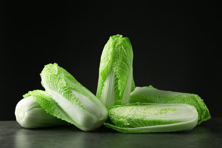 Fresh ripe Chinese cabbages on gray tableの写真素材