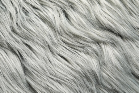 Texture of gray faux fur as background, closeup