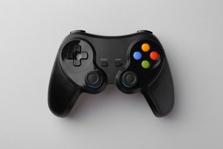 Wireless game controller on light gray background, top view
